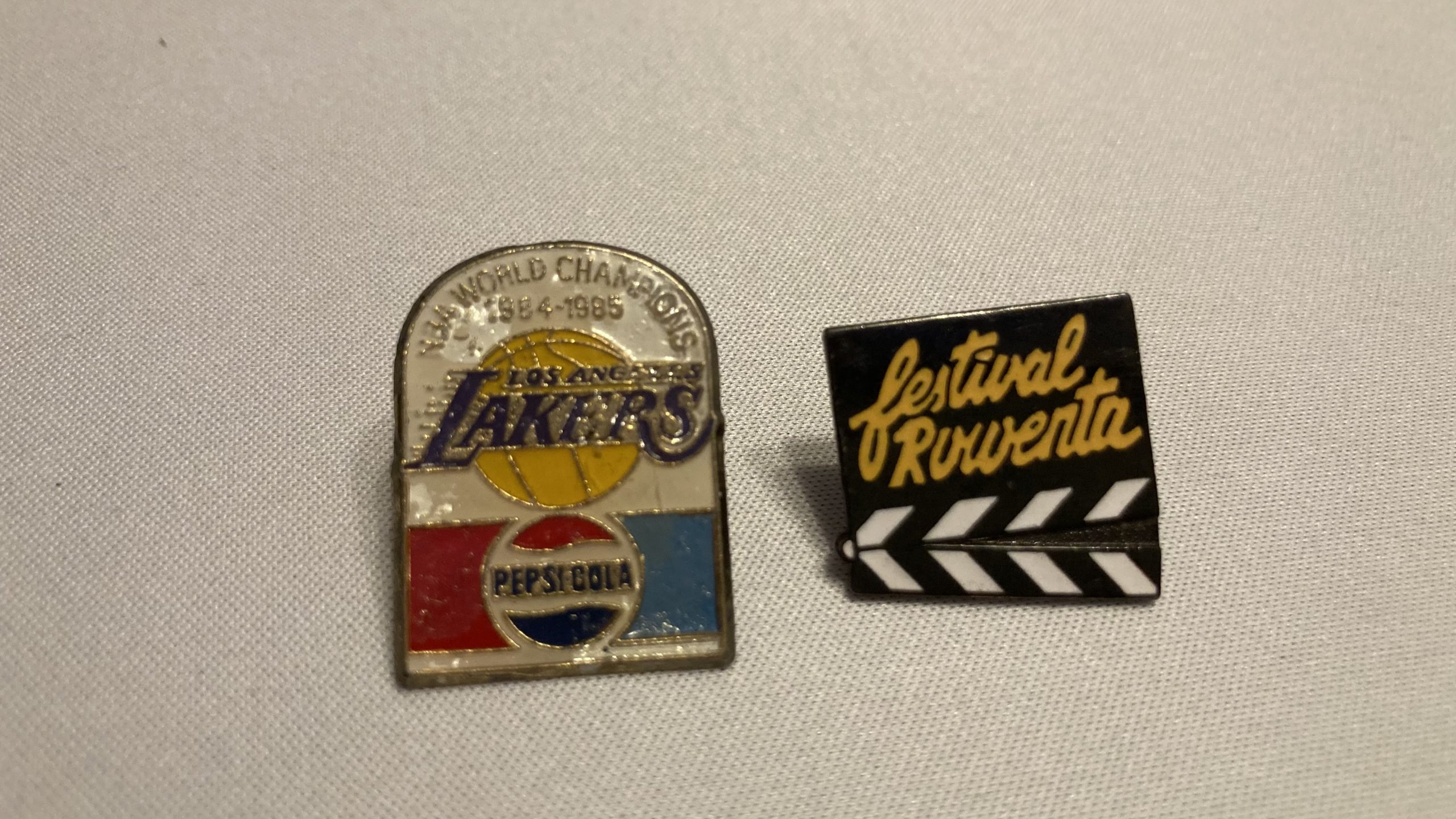 Karen's tat - an NBA/Pepsi pinbadge and Festival Rowenta clapper board tattoo