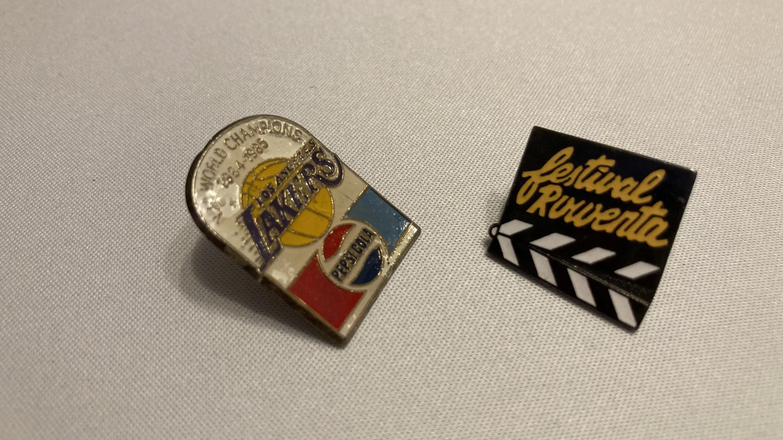 Karen's tat - an NBA/Pepsi pinbadge and Festival Rowenta clapper board tattoo