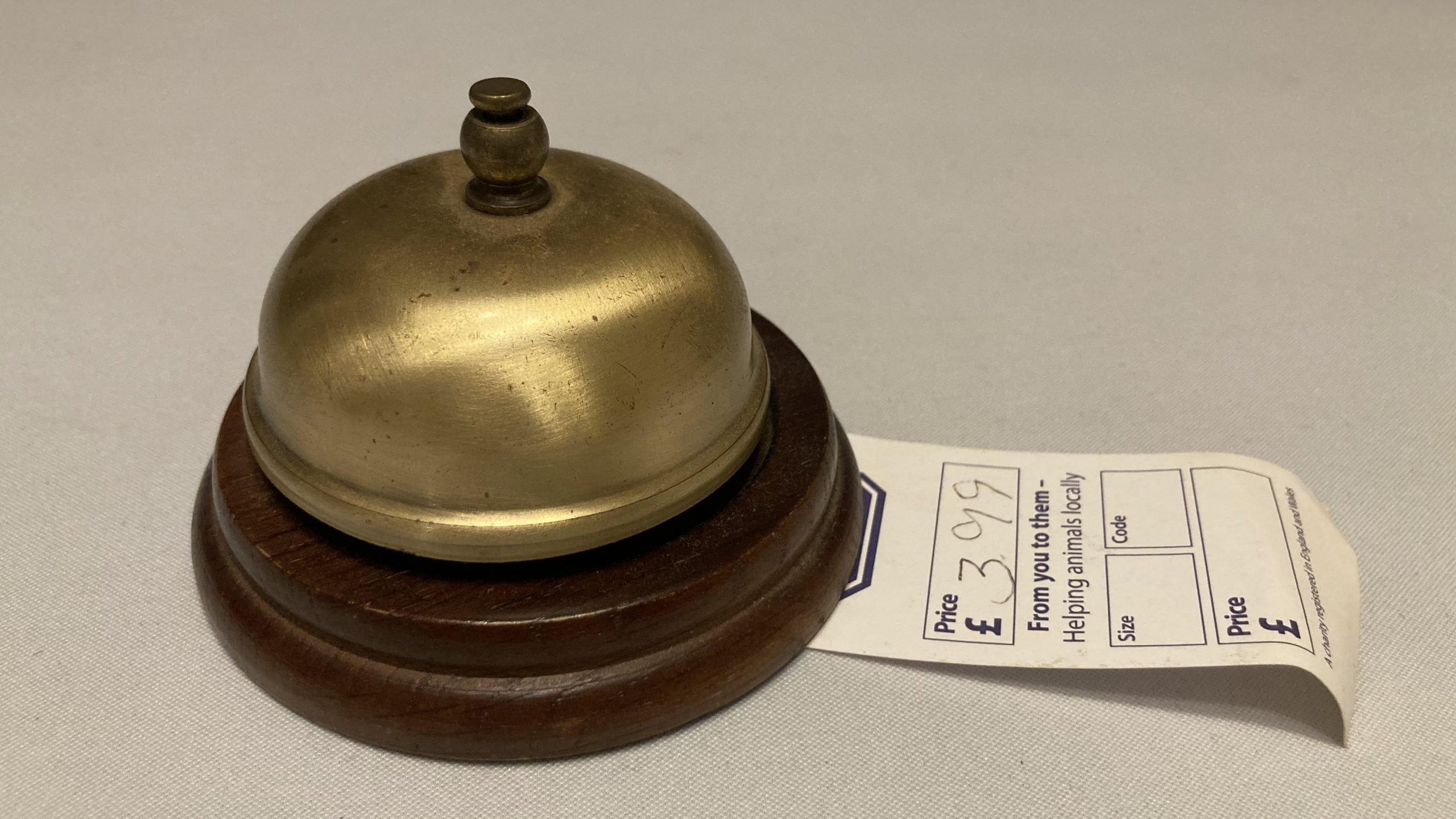 Adam's tat - an old desk bell