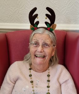 Mum at Christmas time 2024 - she'd only been at the home for a month or so and was still having some fun with life.