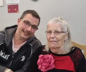Mum and I on Mother's Day 2026, with her wearing her now customary huge celebration bow