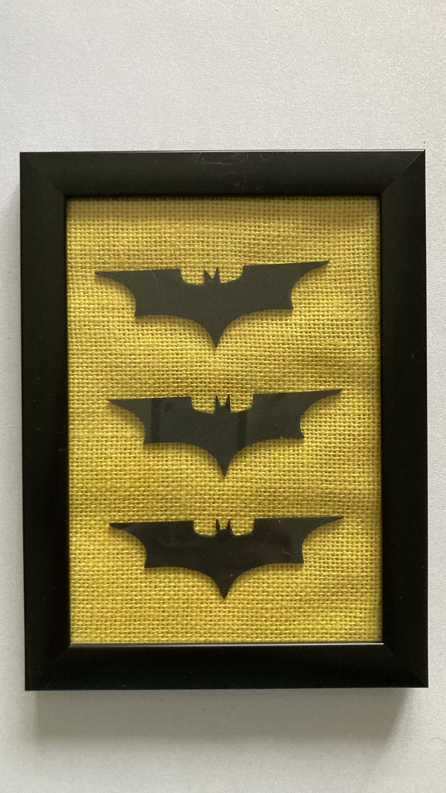 Adam's tat - an upcycled 'Batarang' display