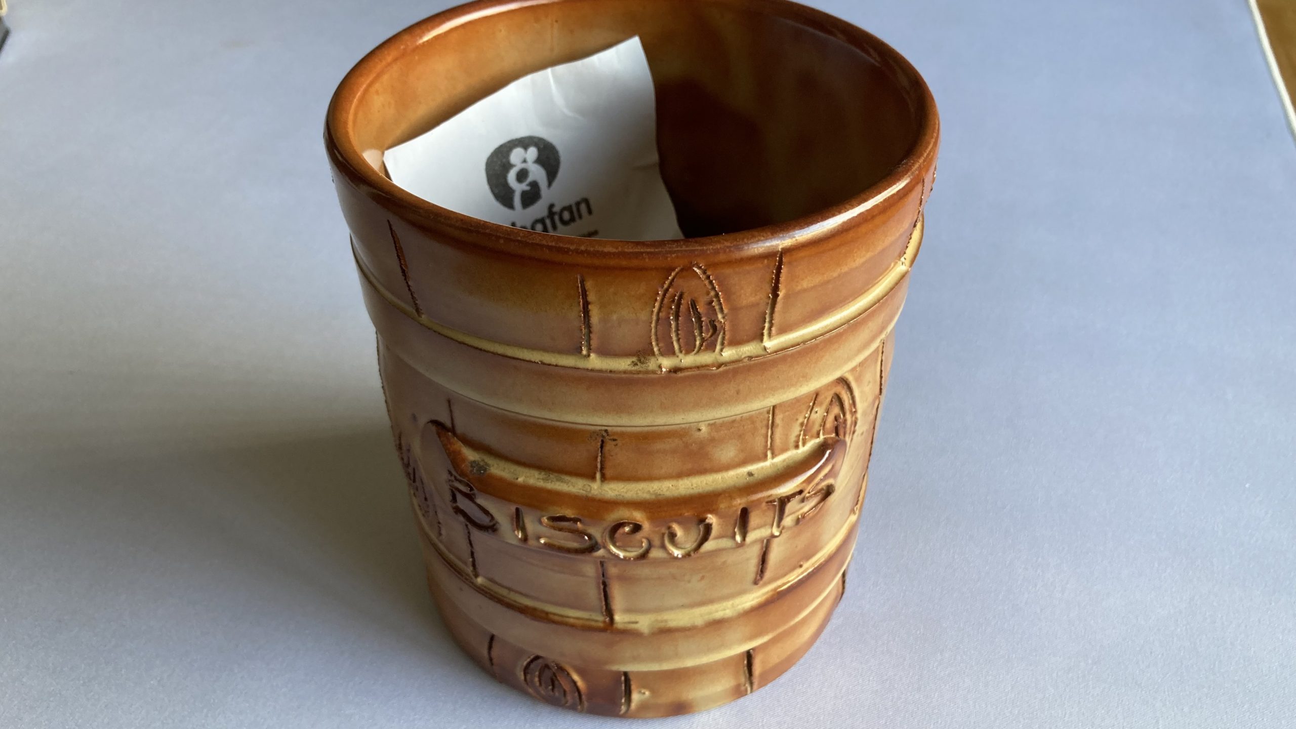 Karen's tat - her 'biscuit barrel of shame'
