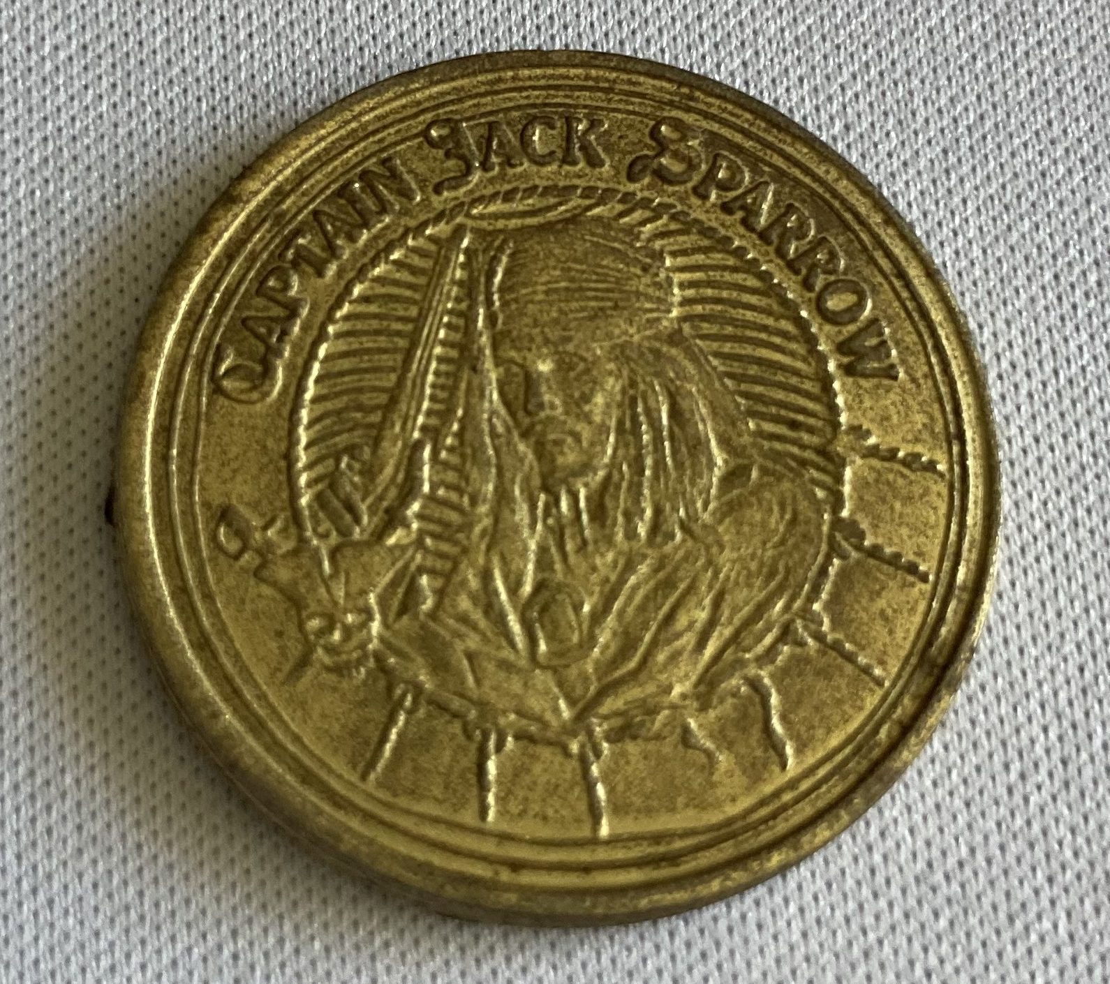 Adam's tat - a 'Pirates of the Caribbean: Dead Man's Chest' tie-in coin
