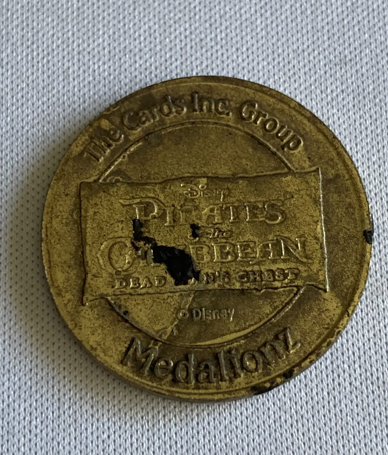 Adam's tat - a 'Pirates of the Caribbean: Dead Man's Chest' tie-in coin